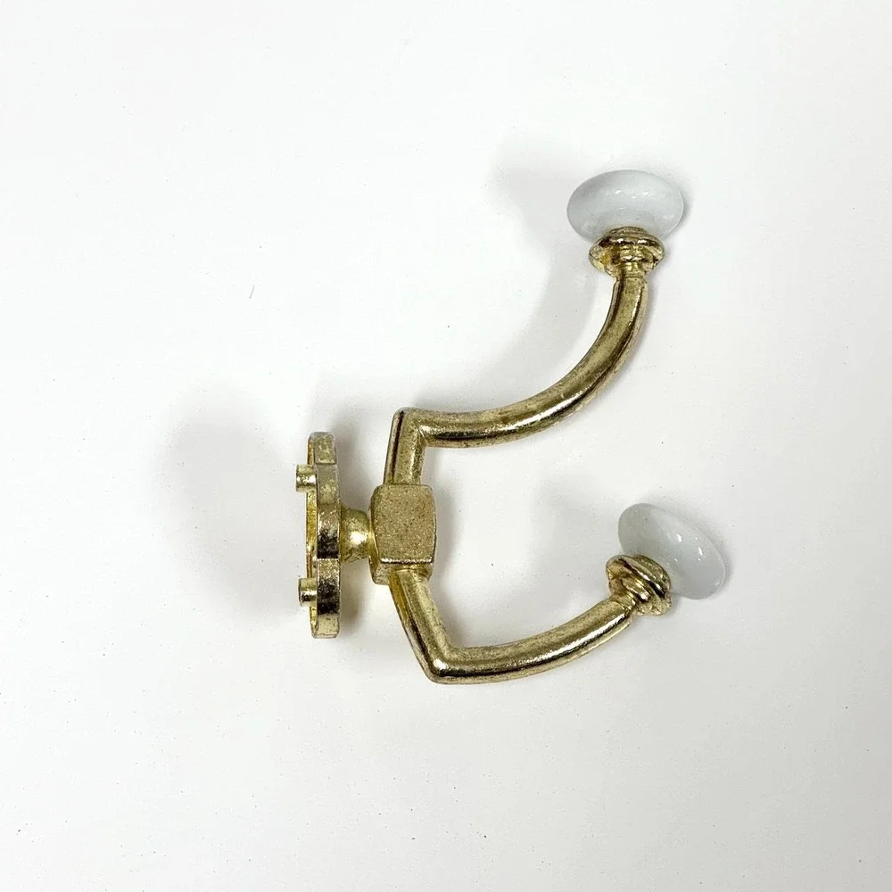 Vintage brass and porcelain double wall hook